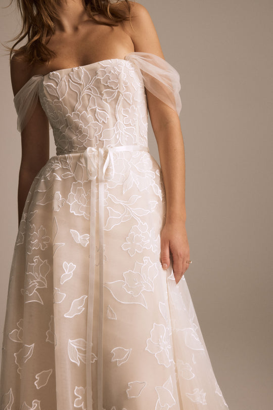 Calypso, $4,395, dress from Collection Bridal by Nouvelle Amsale, Fabric: floral-embroidered-tulle